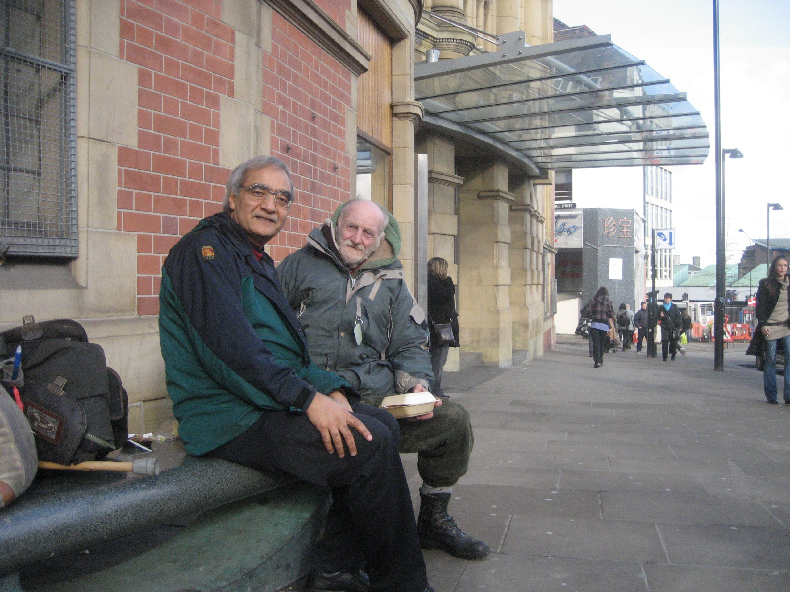 Inderjit and Albert eat bread together in Sheffield